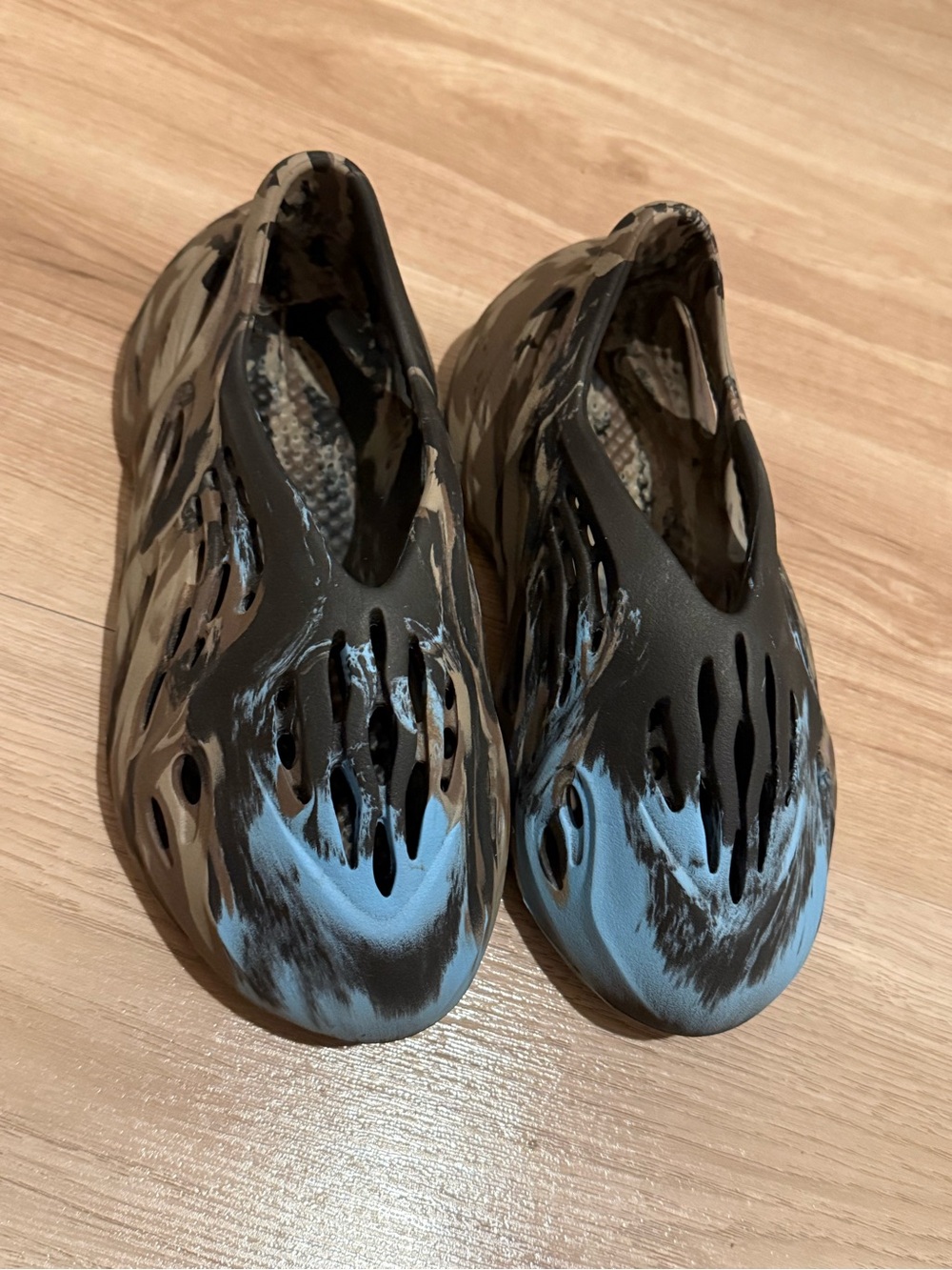 Yeezy Foam Runners in Black and Light Blue Swirl